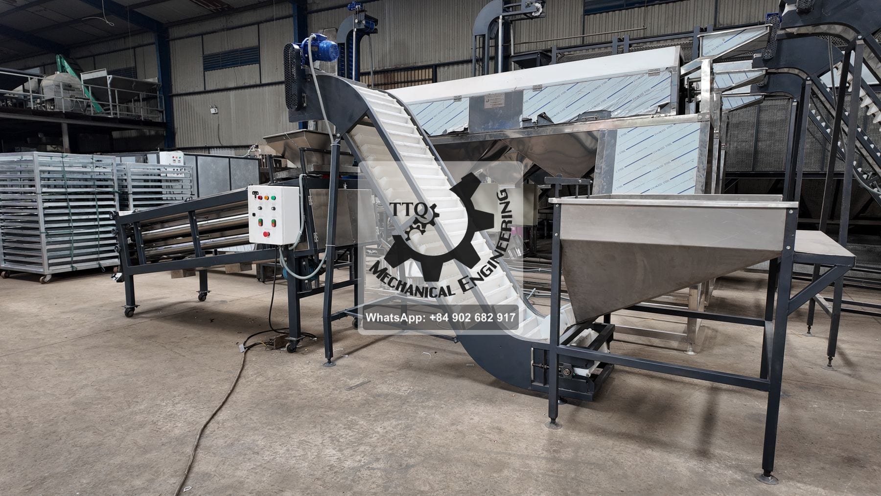 A TTQ kernel grading machine in build, with feed hopper, cleated incline elevator and roller section