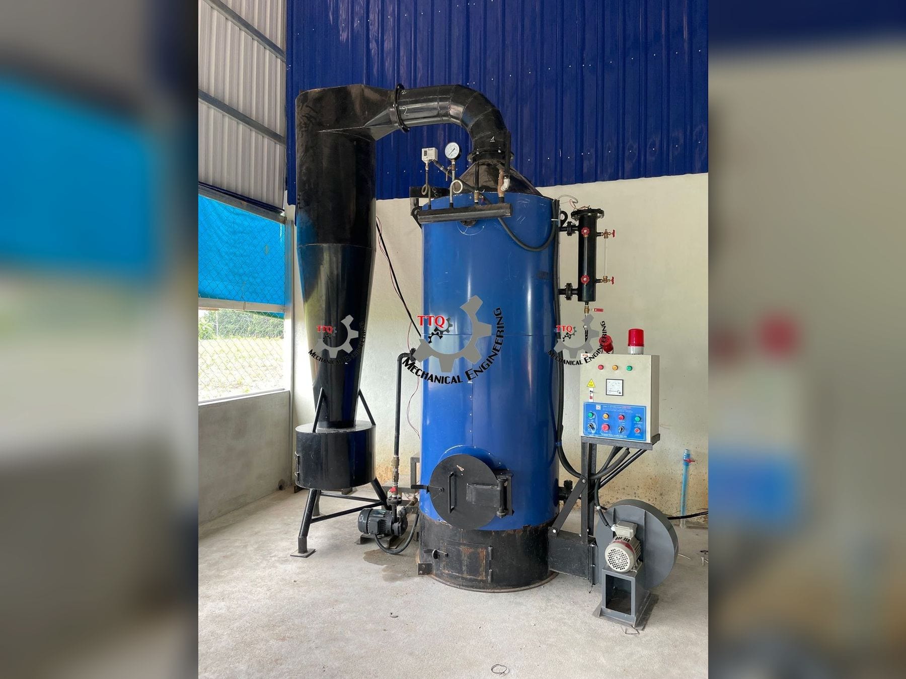 A vertical shell-fired boiler installed in a plant, with cyclone dust collector and forced-draught fan