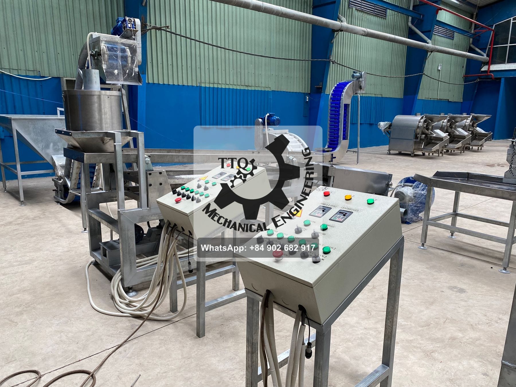 A TTQ shelling line installed in a customer plant, with labelled control pedestals for shelling, centrifuges, sieve and fans